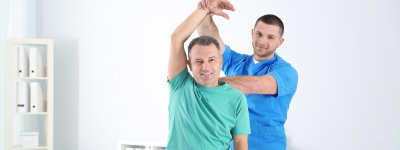 Doctor working with patient in hospital. Rehabilitation physiotherapy